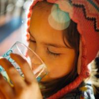 Child drinking water from a glass
